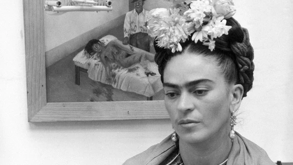 Frida stands before a painting in "Frida: Viva la Vida".