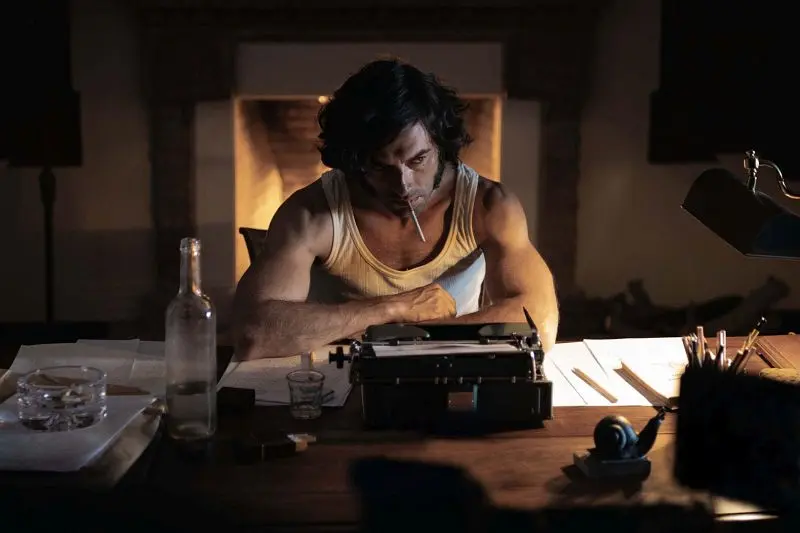 Man at typewriter in "La casa del caracol", late at night with a cigarette.